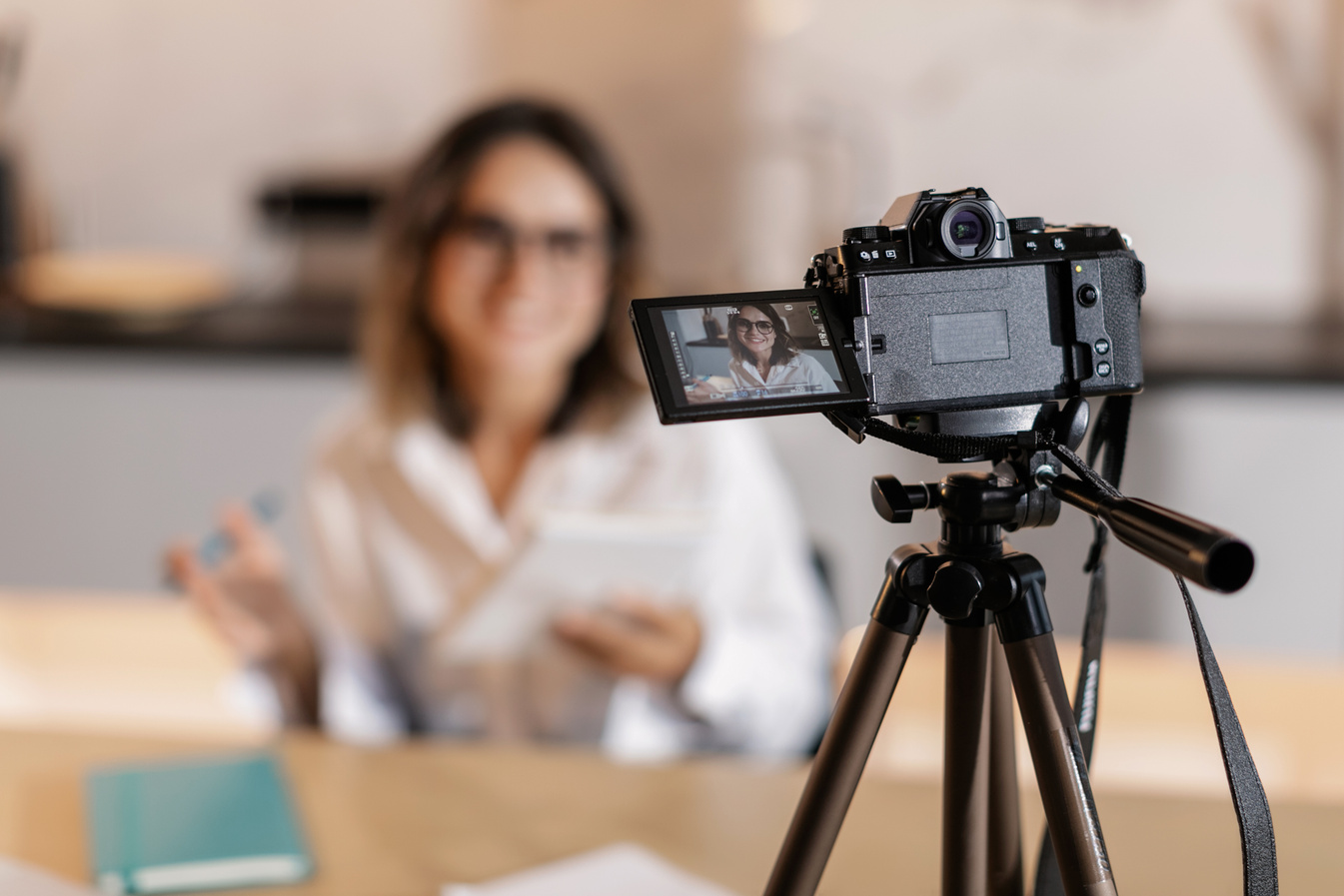 Woman in White Long Sleeve Shirt Vlogging